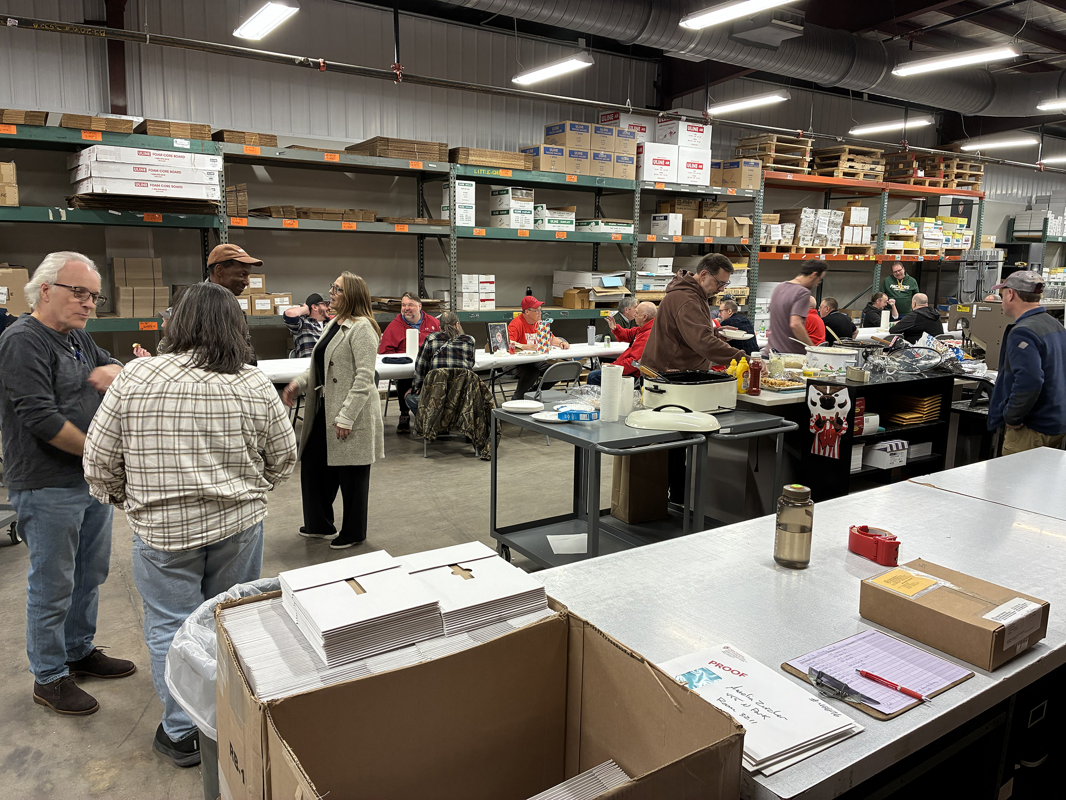 Current and former DPPS employees conversing during our celebration on March 12, 2026.