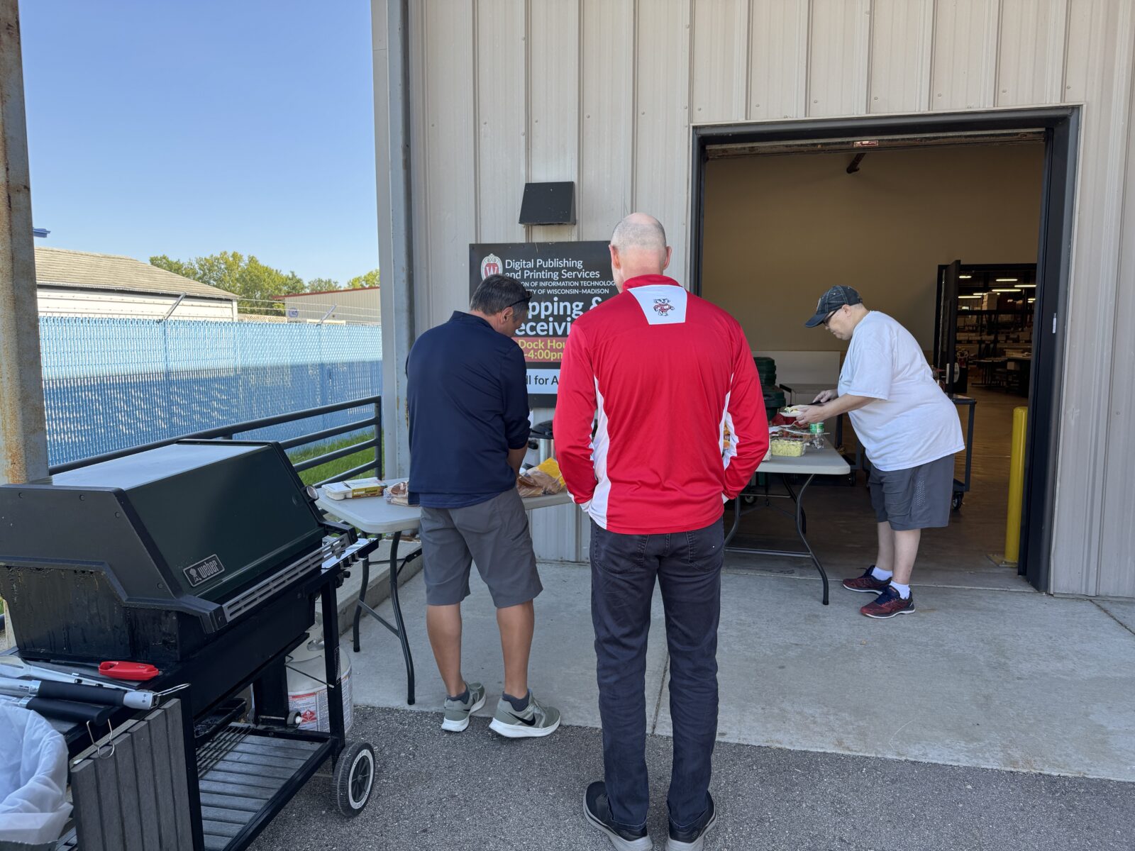 James, Steve, and Kris are in the tailgate food line at DPPS.